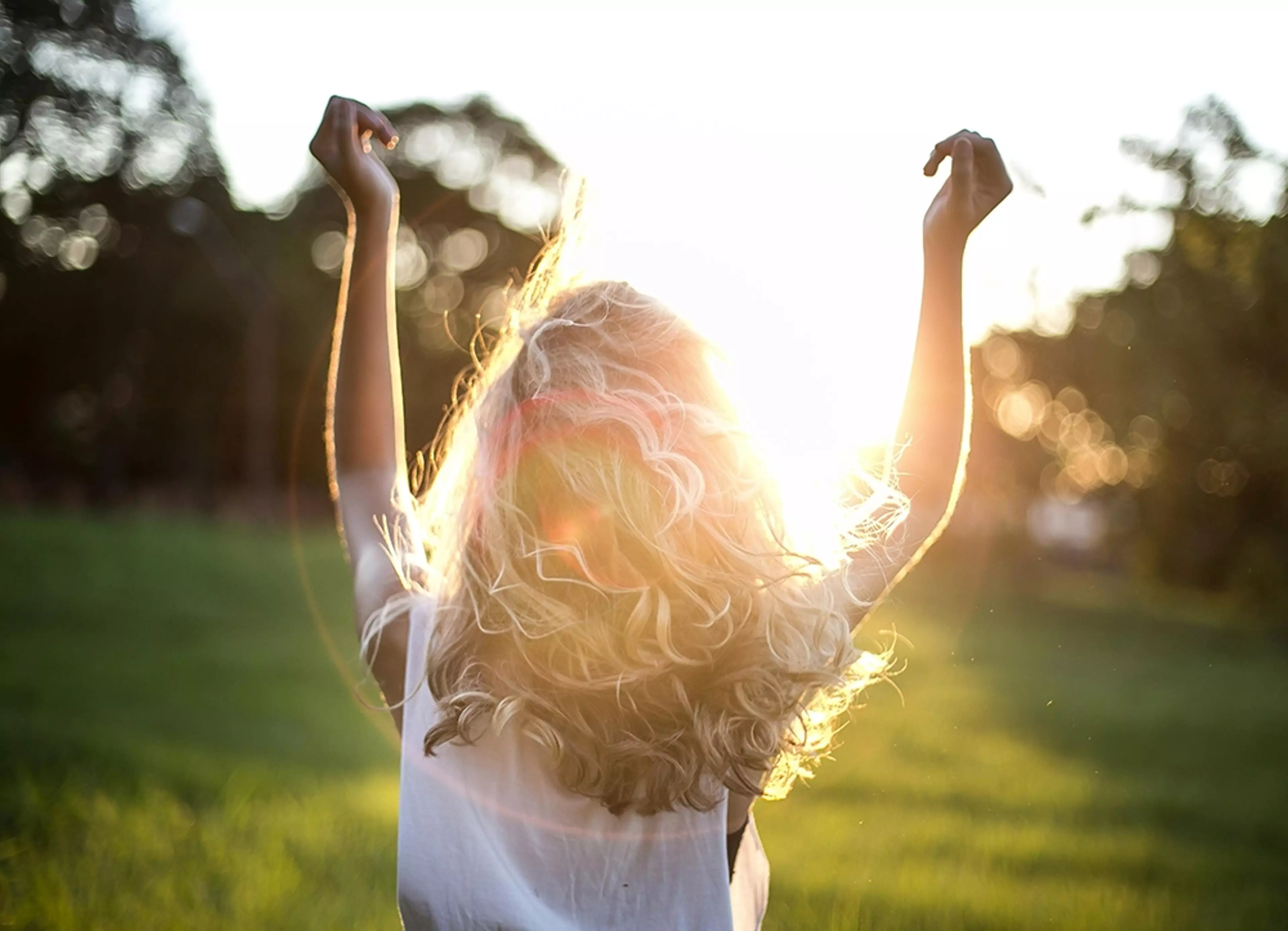 Woman Wearing White Top by Garon Piceli